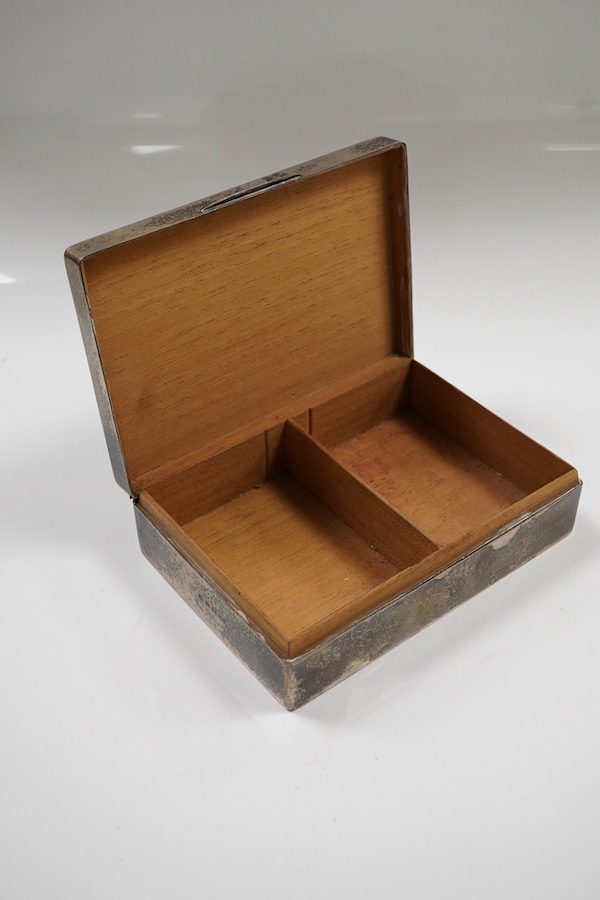 A George V engine turned silver mounted rectangular cigarette box, by William Neale Ltd, Birmingham, 1935, 16.2cm.